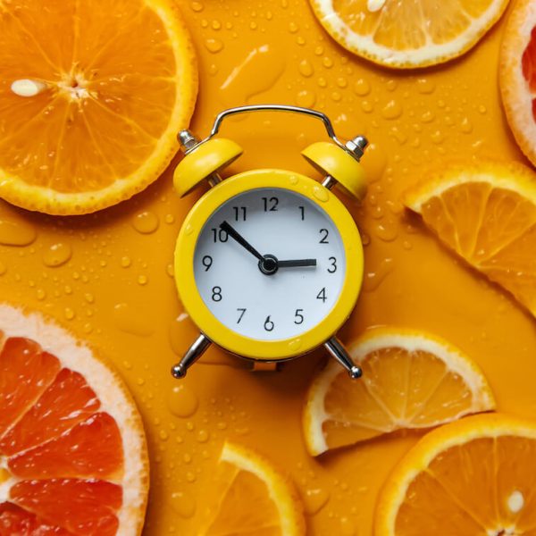clock-and-citruses-summer-time-concept-selective-2023-11-27-04-56-51-utc